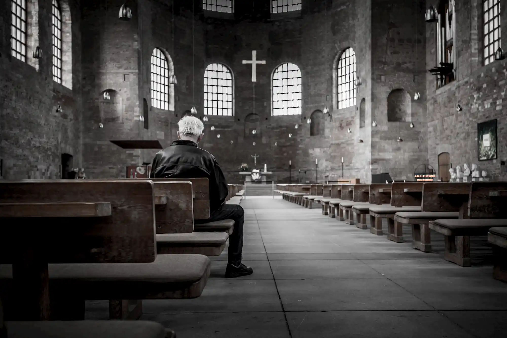 Man sitting in an empty church