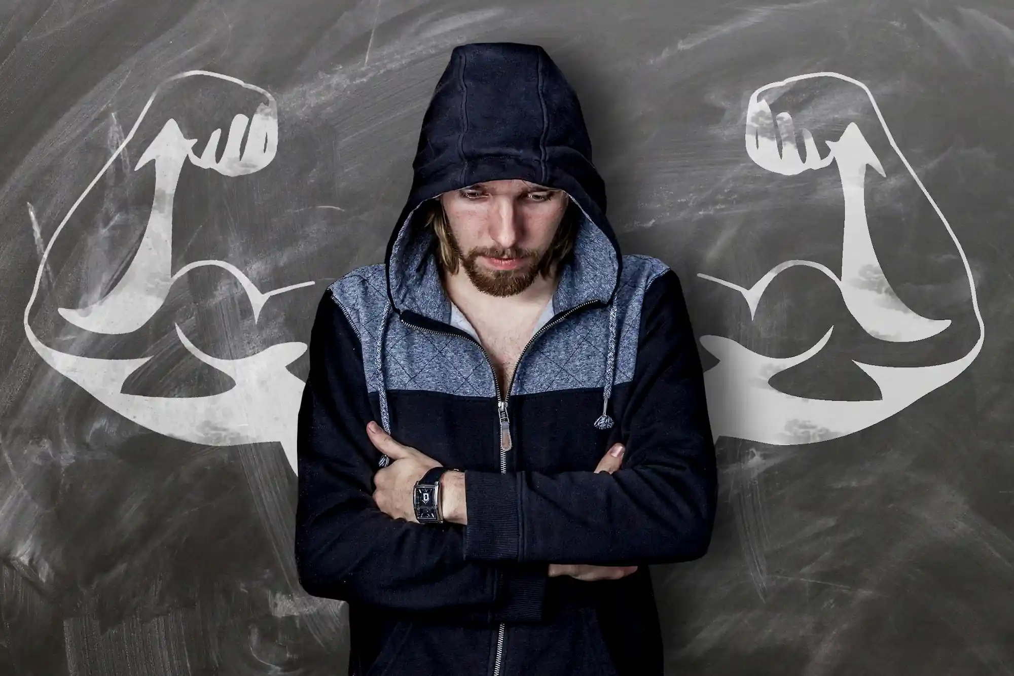 Man with strong arms drawn in chalk